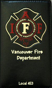 IAFF logo with American and Canadian flags on a black pocket calendar cover