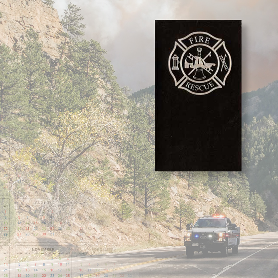 Fireaxe Cover with a mountain road background of a first responder vehicle driving with a wildfire in the distance